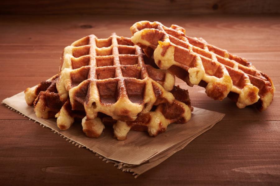 Belgian waffles on a wooden surface.